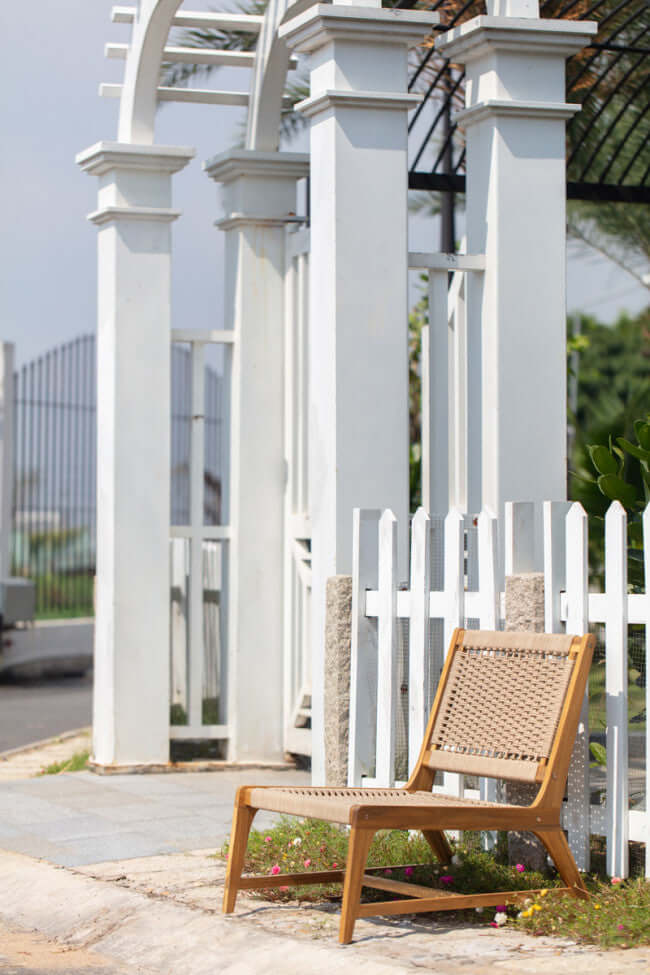 Panama Jack Adirondack chair made with solid Acacia wood construction and fast drying tan rope