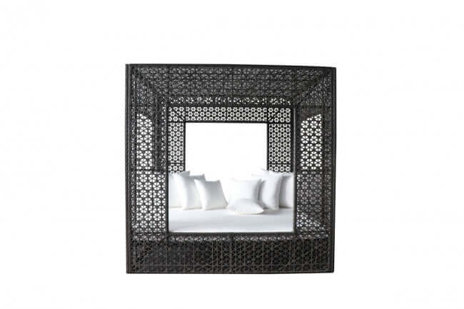 Panama Jack cube-shaped outdoor daybed built with weather-resistant materials to accommodate up to four people