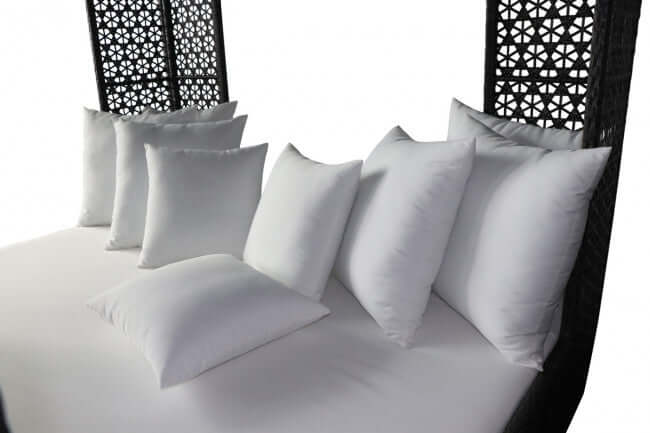 Panama Jack cube-shaped outdoor daybed built with weather-resistant materials to accommodate up to four people