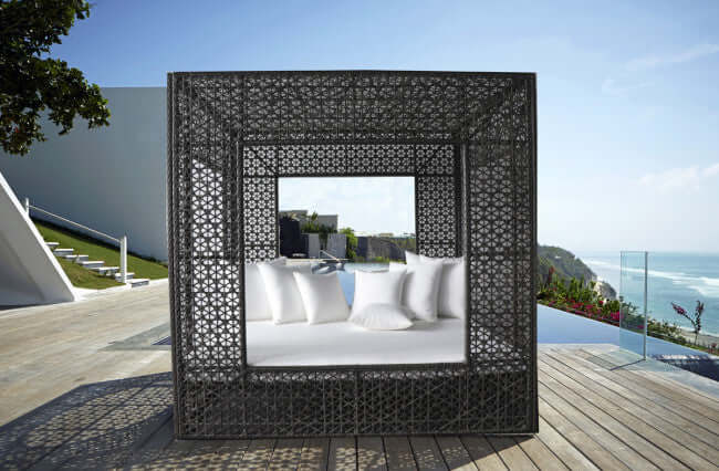 Panama Jack cube-shaped outdoor daybed built with weather-resistant materials to accommodate up to four people