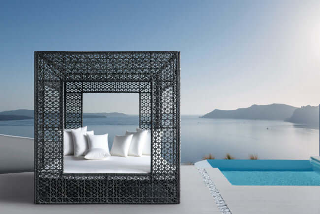 Panama Jack cube-shaped outdoor daybed built with weather-resistant materials to accommodate up to four people