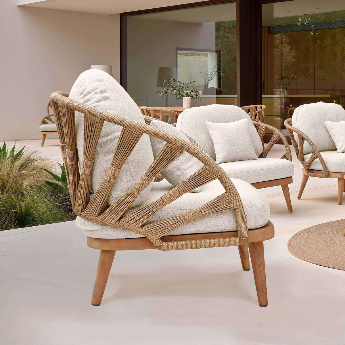 Outdoor armchair made from teak wood and polystrand rami natural rope