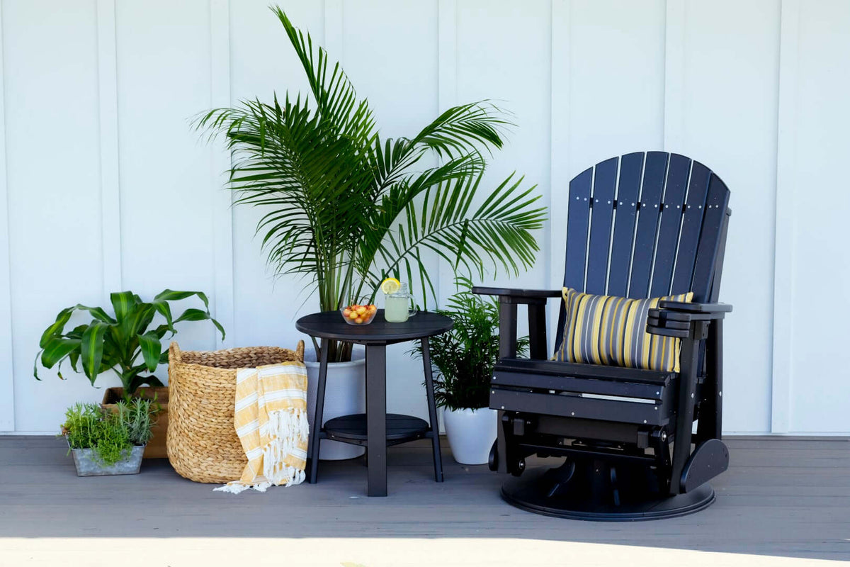 LuxCraft 2' Adirondack Swivel Glider in Black configured for backyard lounging — fade-resistant poly