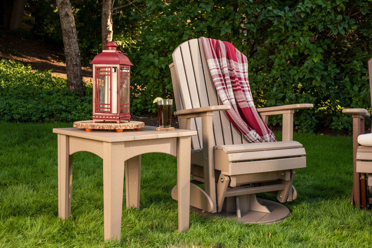 LuxCraft 2' Adirondack Swivel Glider in Weatherwood styled for patio rotation seating — 20-year poly durability