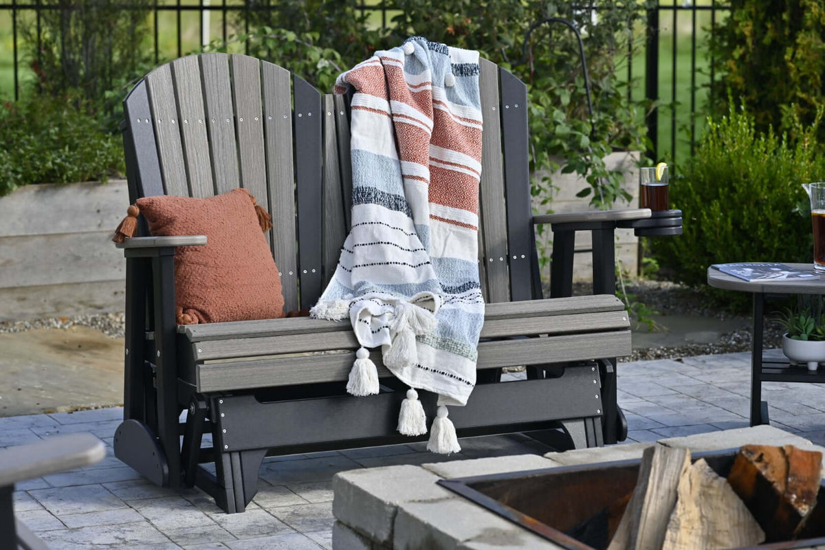 LuxCraft 4' Adirondack Glider in Coastal Gray and Black paired for patio installations — weather-resistant design