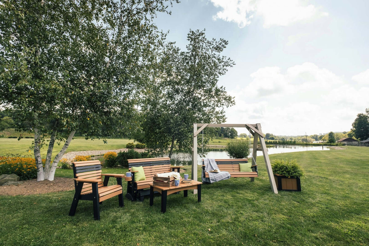 LuxCraft 4' Plain Balcony Glider in Cedar and Black positioned for elevated decks — all-weather outdoor build