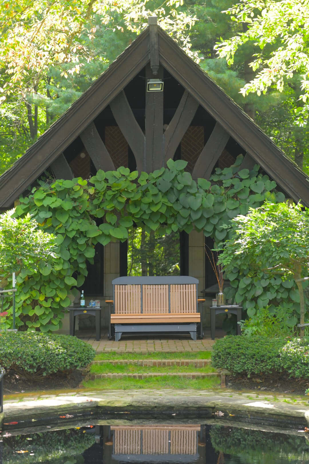 LuxCraft 5' Classic Glider in Cedar and Black — Amish-crafted recycled poly, weather-resistant design