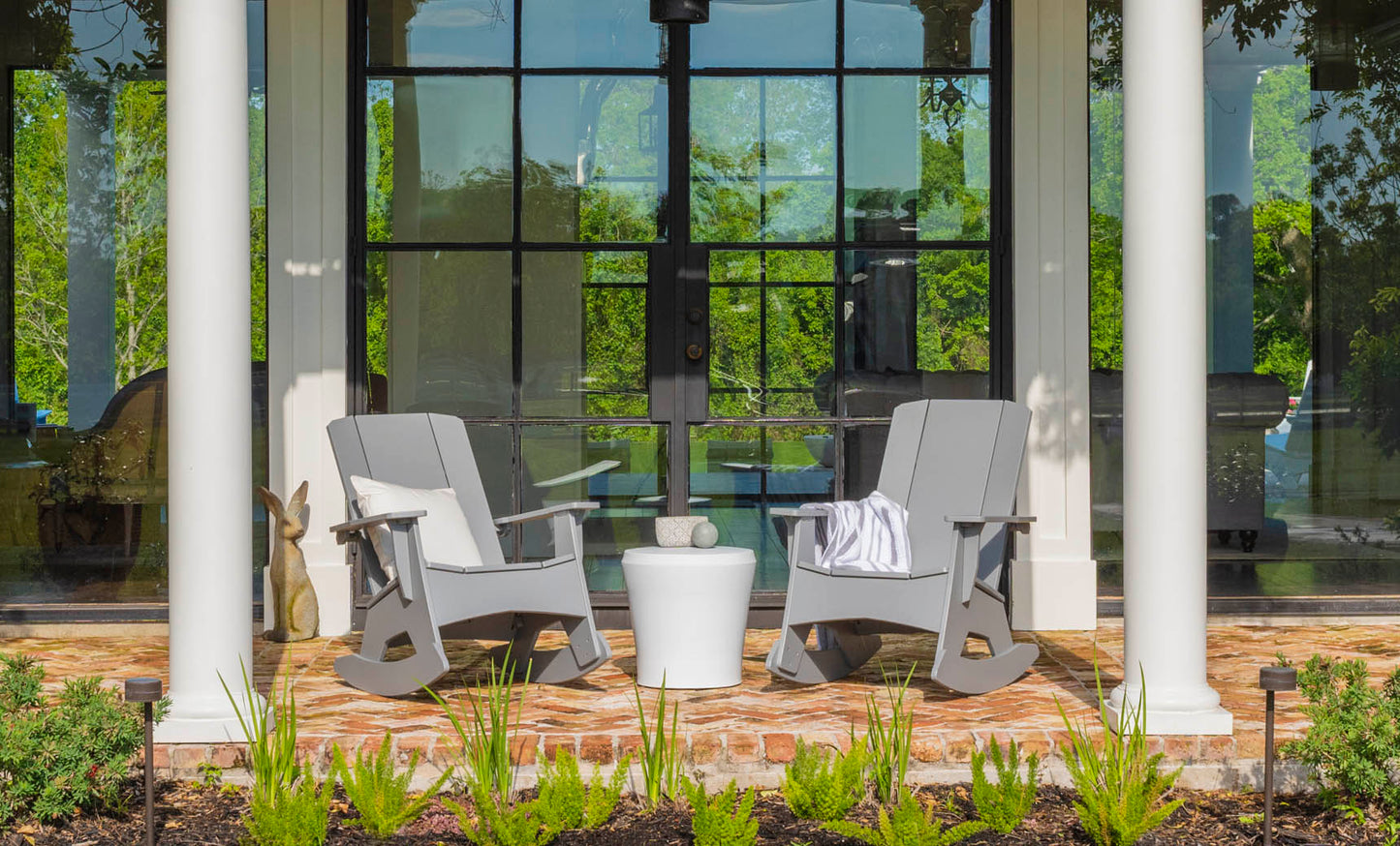 Affinity Side Table used on a porch between two rocking chairs