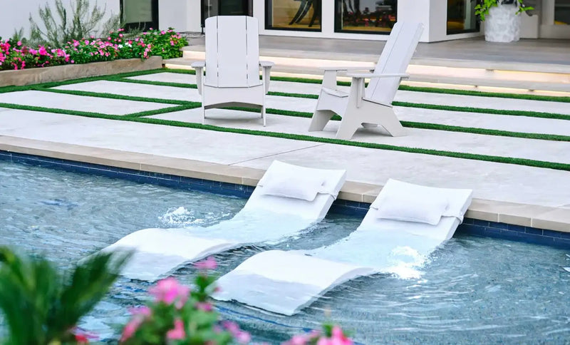 This luxurious set includes two Signature In-Pool Chaise Loungers and two matching Headrest Pillows, designed for ultimate comfort on your pool’s tanning ledge, baja shelf, or sun shelf with water depths of 0-9 inches.