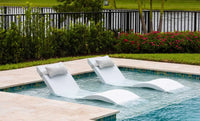 This luxurious set includes two Signature In-Pool Chaise Loungers and two matching Headrest Pillows, designed for ultimate comfort on your pool’s tanning ledge, baja shelf, or sun shelf with water depths of 0-9 inches.
