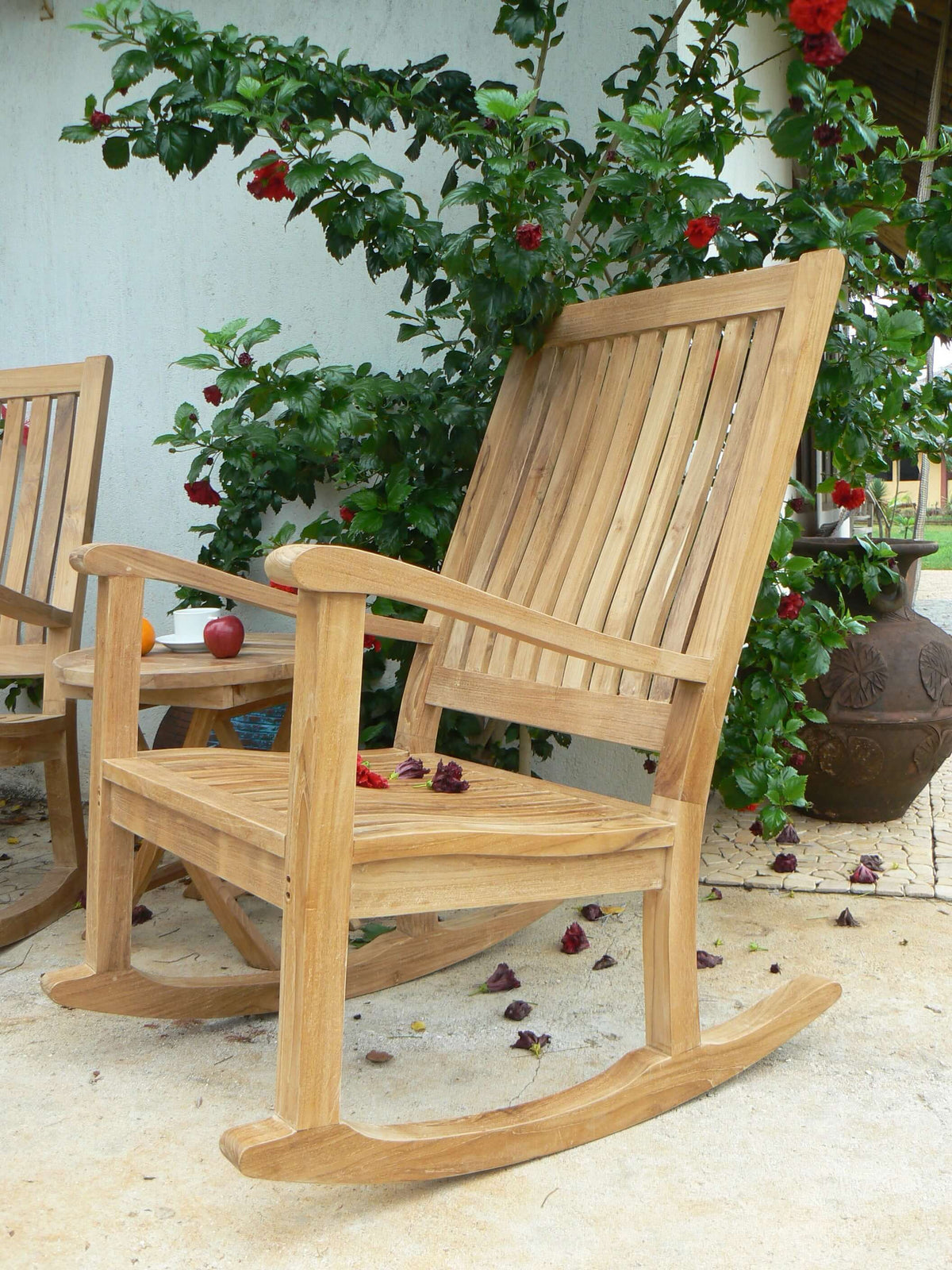 Anderson Teak Del Amo Rocking Armchair on Front Porch in Classic Setting