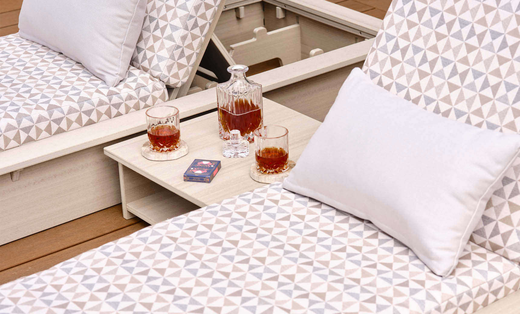 Echo Side Table with a decanter, glasses, and cards on a deck