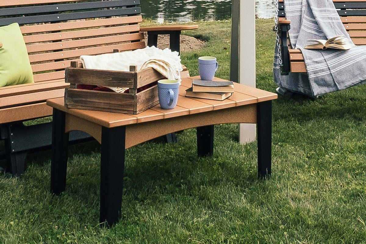 LuxCraft Outdoor Island Coffee Table in Cedar and Black positioned for outdoor patio seating — all-weather outdoor build