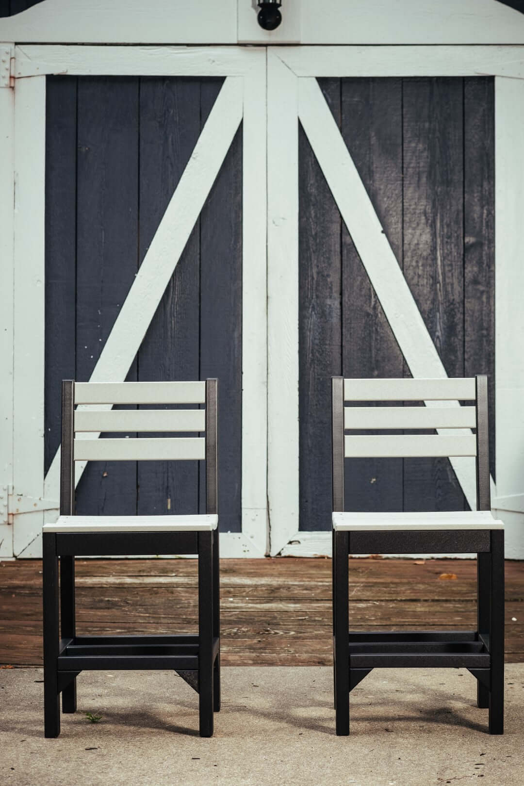 LuxCraft Island Side Chair in Dove Gray and Black — side profile view, wide-armrest patio chair