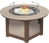 LuxCraft round gas propane outdoor fire pit table with push-button ignition system and tempered glass wind guard