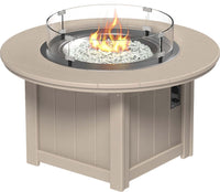 LuxCraft round gas propane outdoor fire pit table with push-button ignition system and tempered glass wind guard