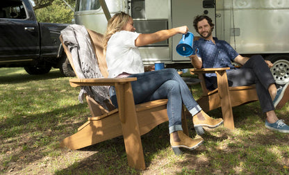 Legacy Adirondack chairs in a Harvest woodgrain finish outdoors