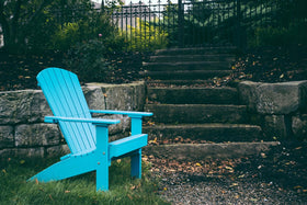 LuxCraft Lakeside Adirondack Chair in Aruba Blue — wide armrests and reclined back for backyard relaxation
