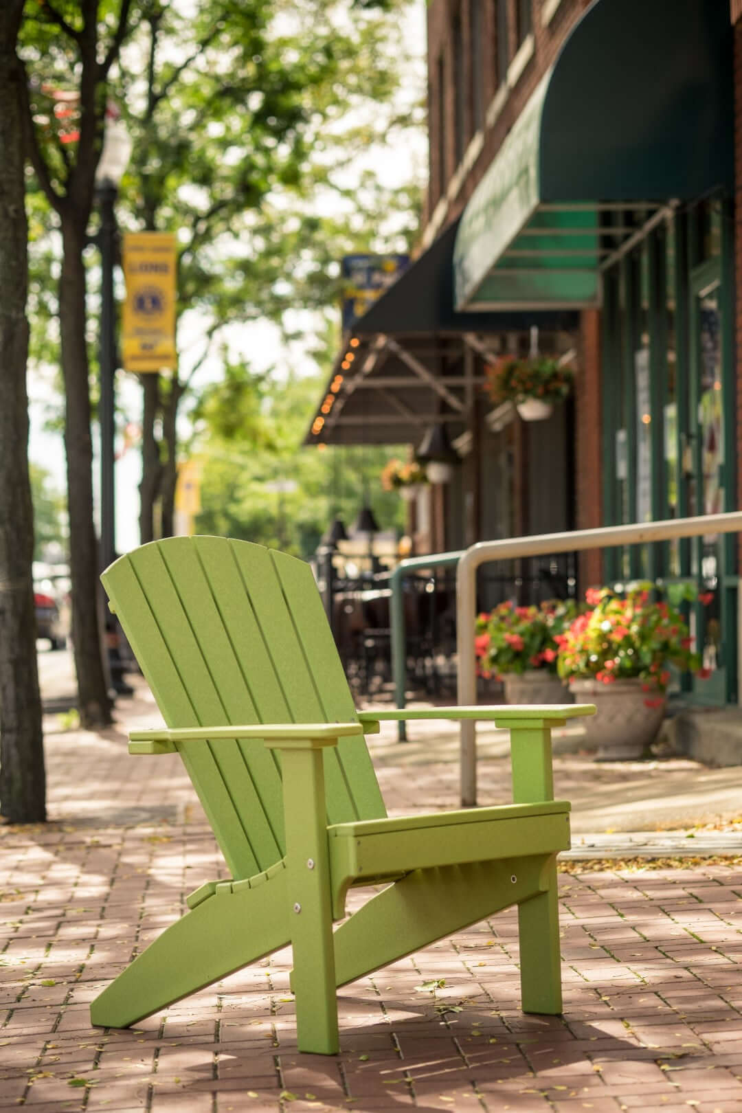 LuxCraft Lakeside Adirondack Chair in Lime Green configured for porch seating — fade-resistant poly