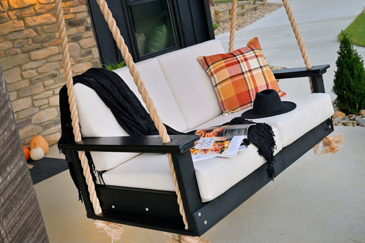 LuxCraft Lanai Loveseat Porch Swing in Black paired for arbor mounting — weather-resistant design