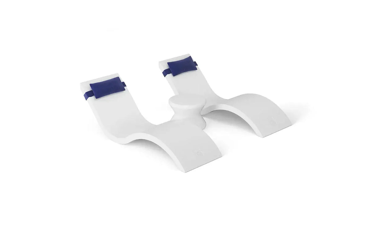 Designed for tanning ledges, baja shelves, or sun shelves with water depths up to 9 inches, this set includes two Signature In-Pool Chaise Loungers, two plush Headrest Pillows, and a versatile Side Table.