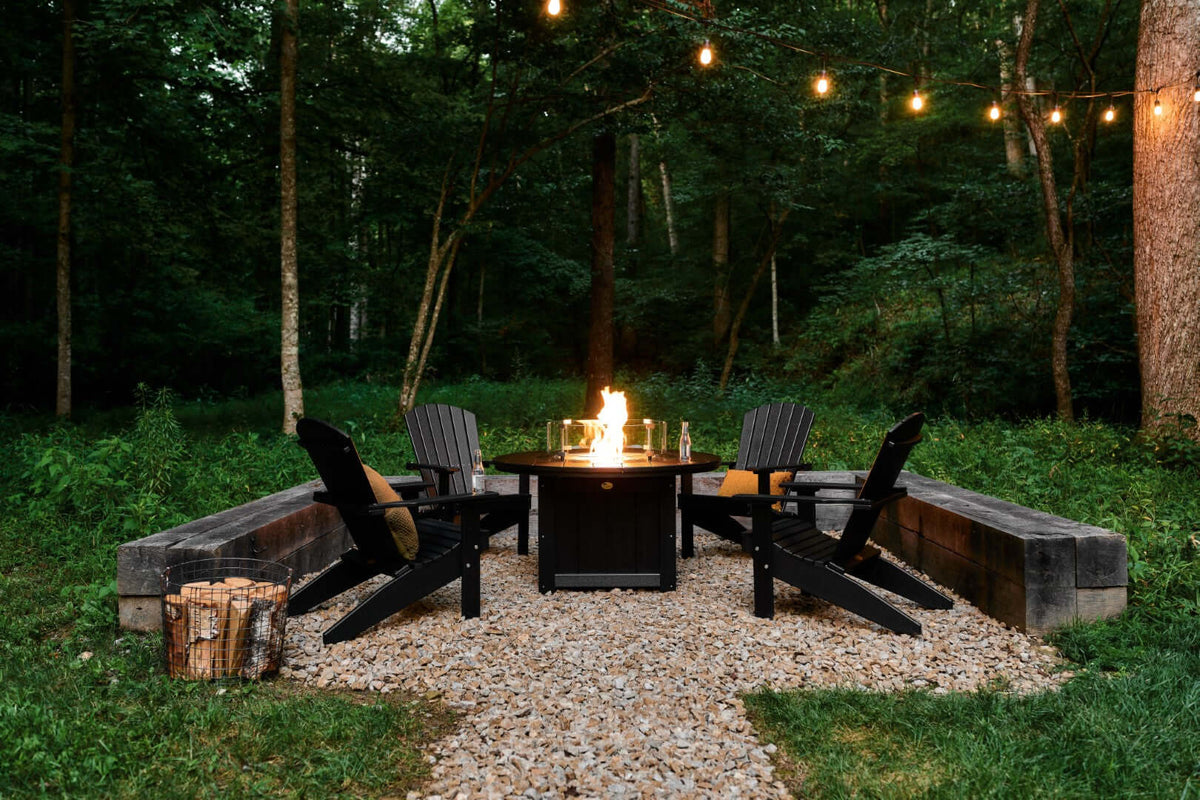 LuxCraft round gas propane fire pit table with Adirondack chairs