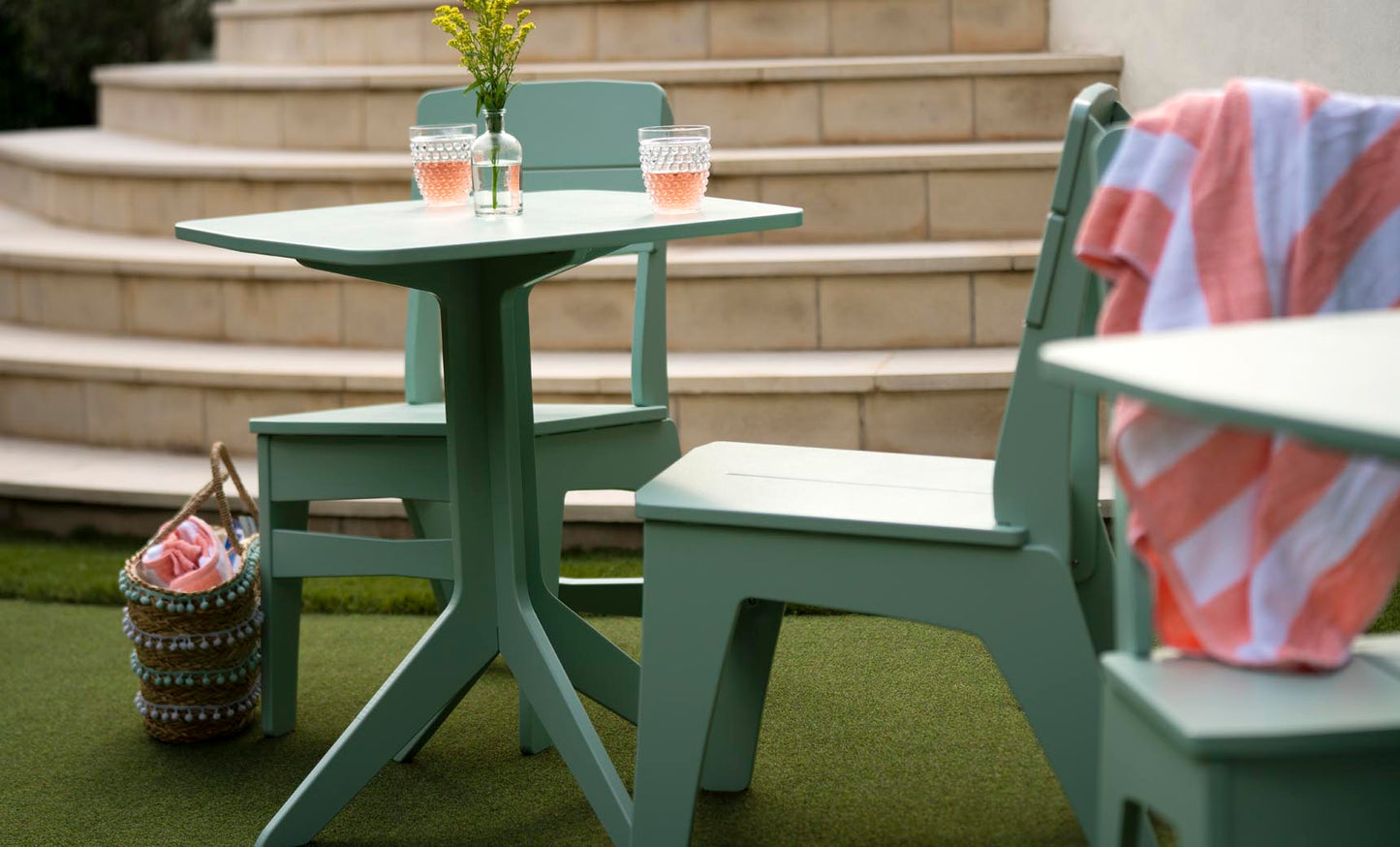 Mainstay Dining Side Chairs in Sage Green on a patio