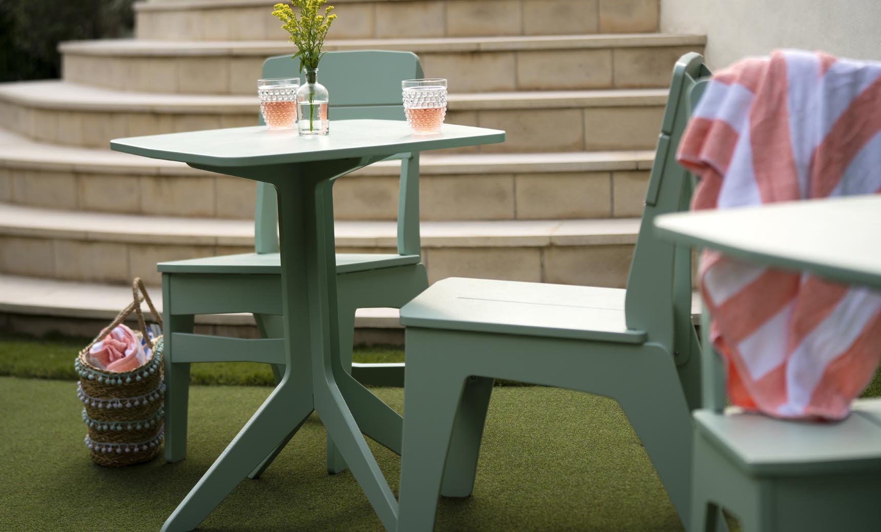 Mainstay Dining Side Chairs in Sage Green on a patio