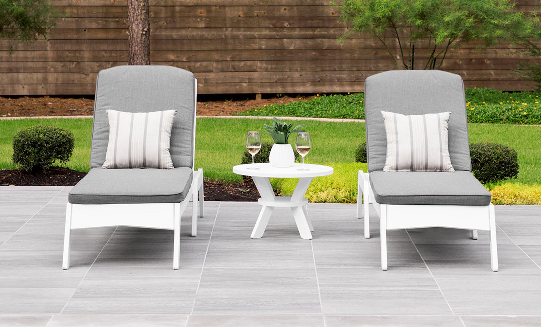 Mainstay Round Side Table between two lounge chairs with drinks