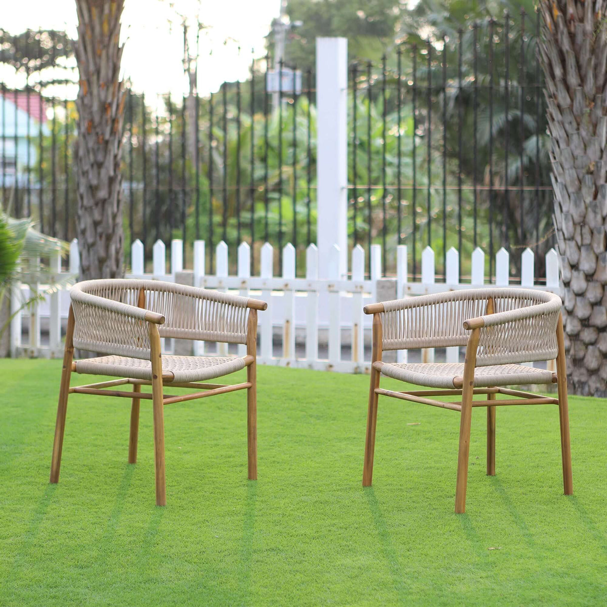 Panama Jack outdoor dining armchairs made with solid Acacia wood construction and fast drying tan rope