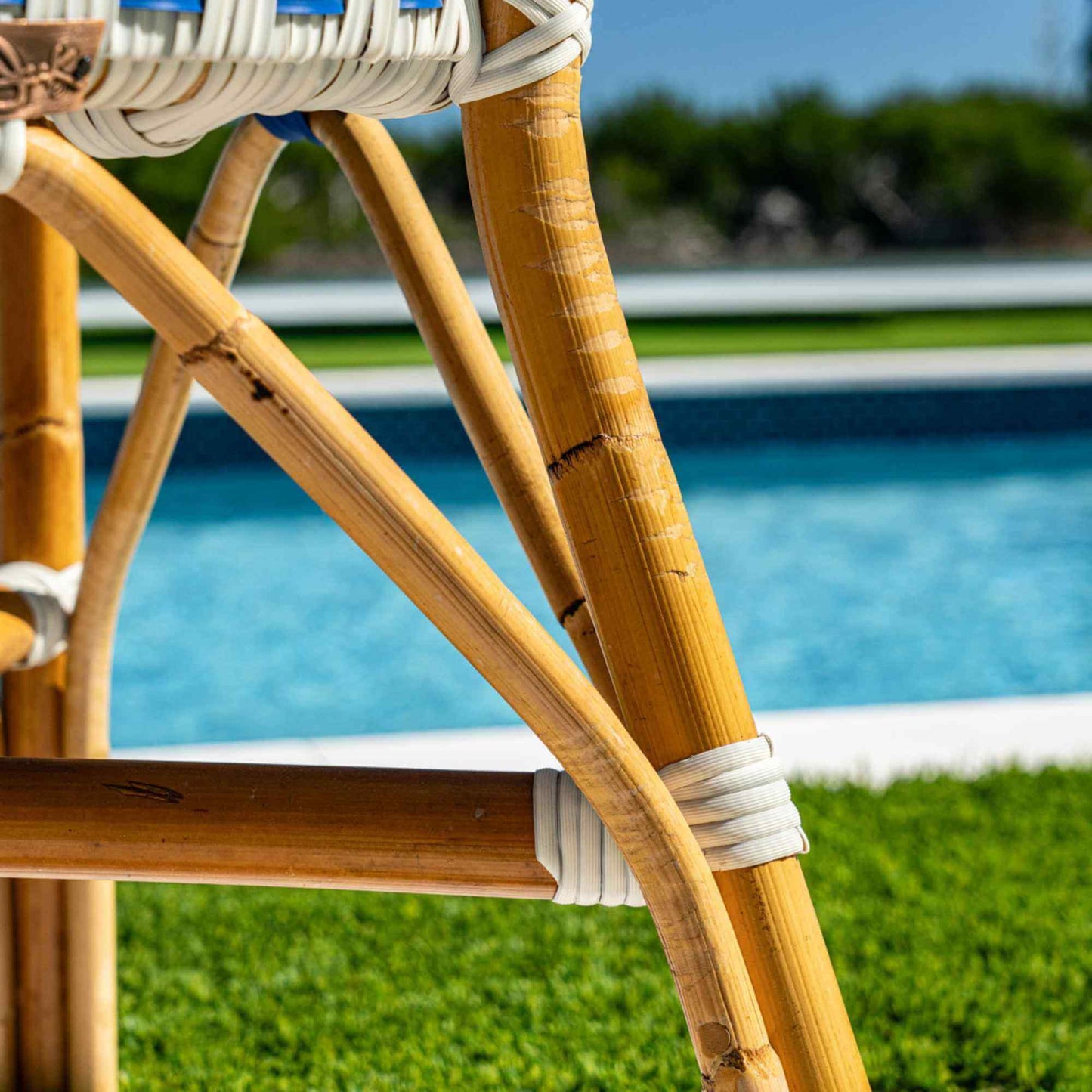 Blue & White bistro loveseat made from synthetic weave and natural rattan