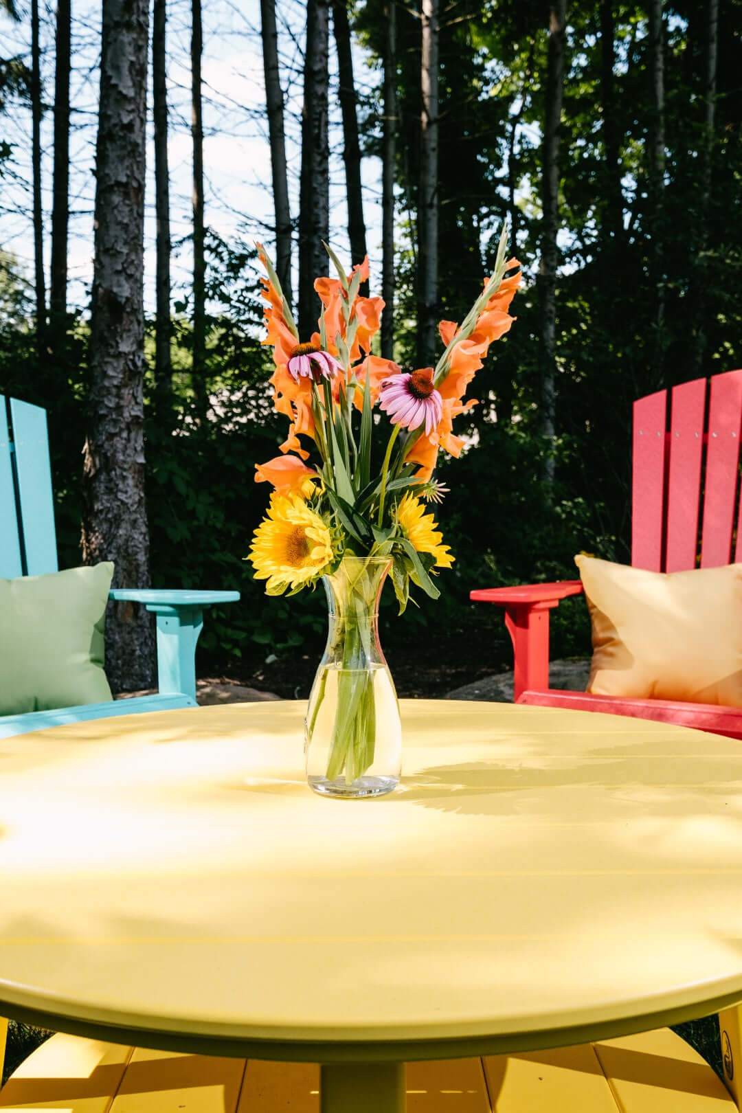 LuxCraft Outdoor Deluxe Conversation Table in Yellow paired for porch and deck use — weather-resistant design