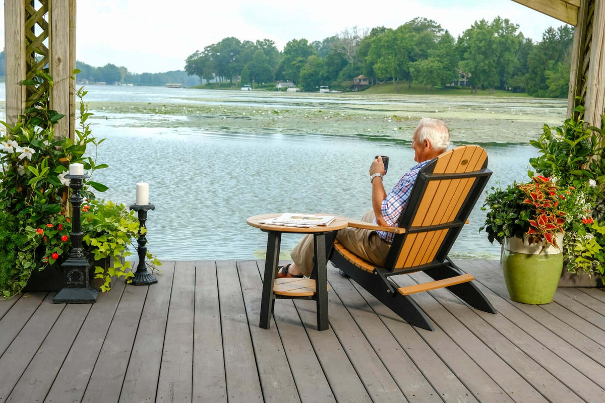 LuxCraft Folding Adirondack Chair in Cedar and Black paired for patio lounging — weather-resistant design