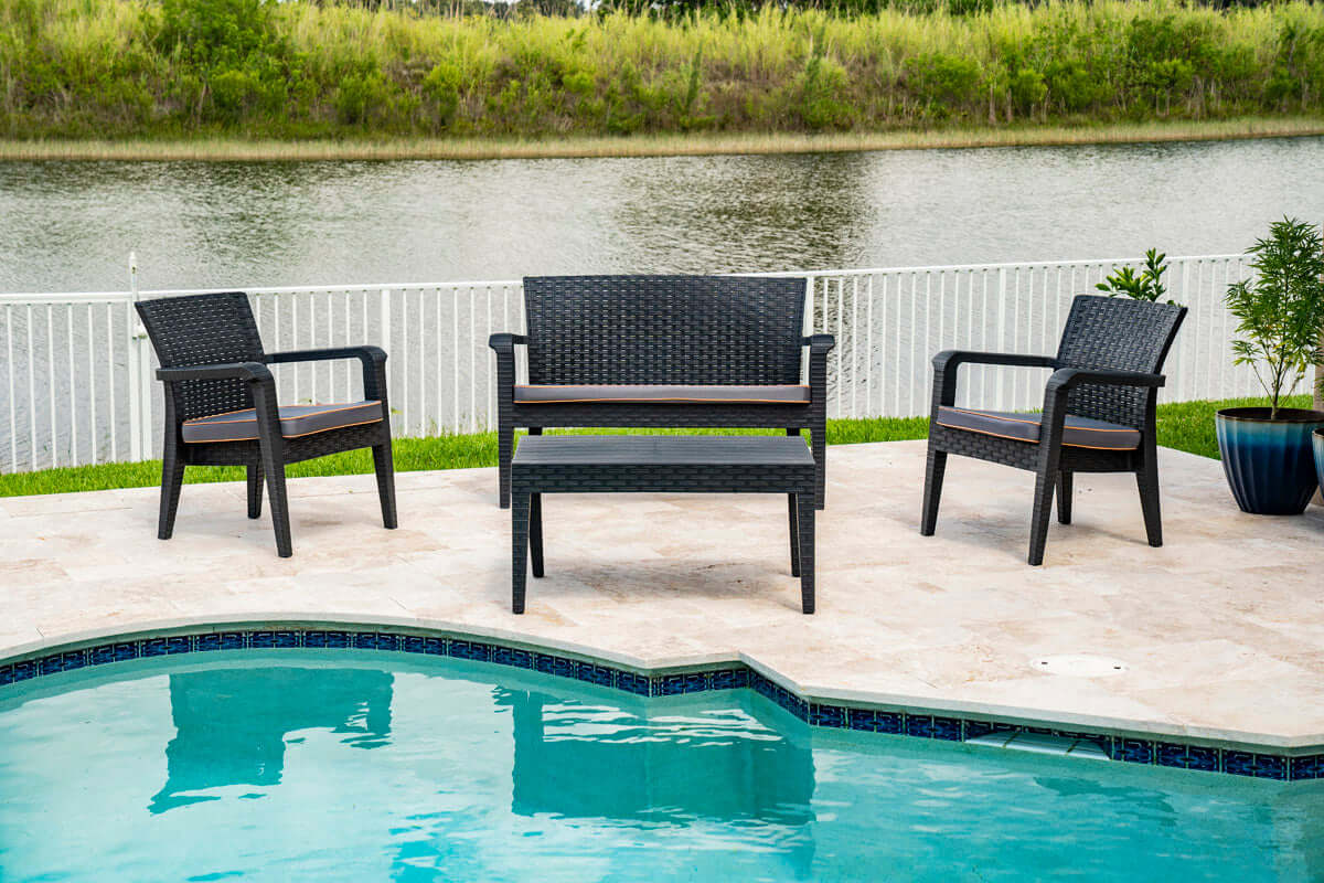 Black 4-piece outdoor seating set with anthracite cushions includes 1 coffee table, 2 stackable armchairs and 1 loveseat