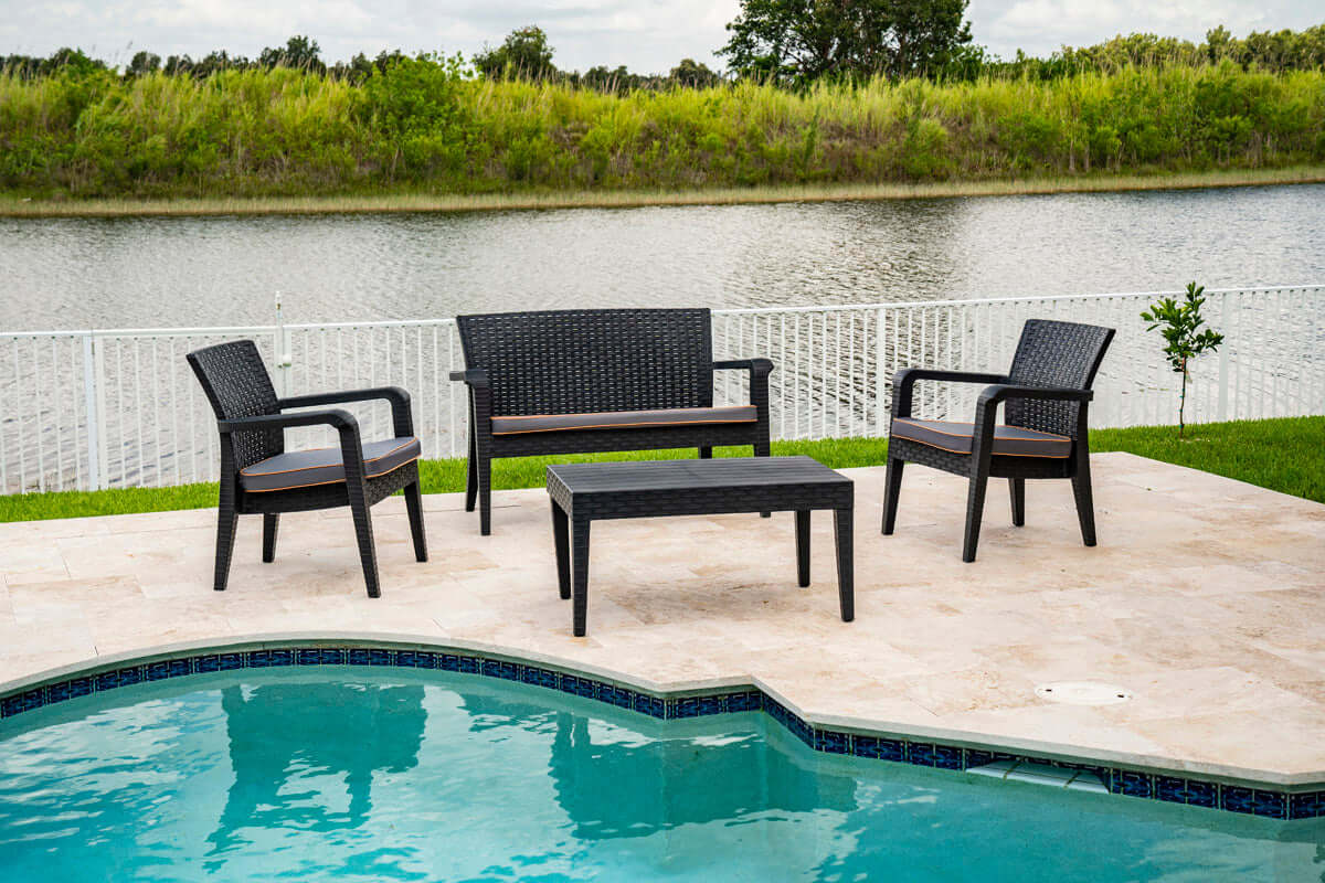 Black 4-piece outdoor seating set with anthracite cushions includes 1 coffee table, 2 stackable armchairs and 1 loveseat