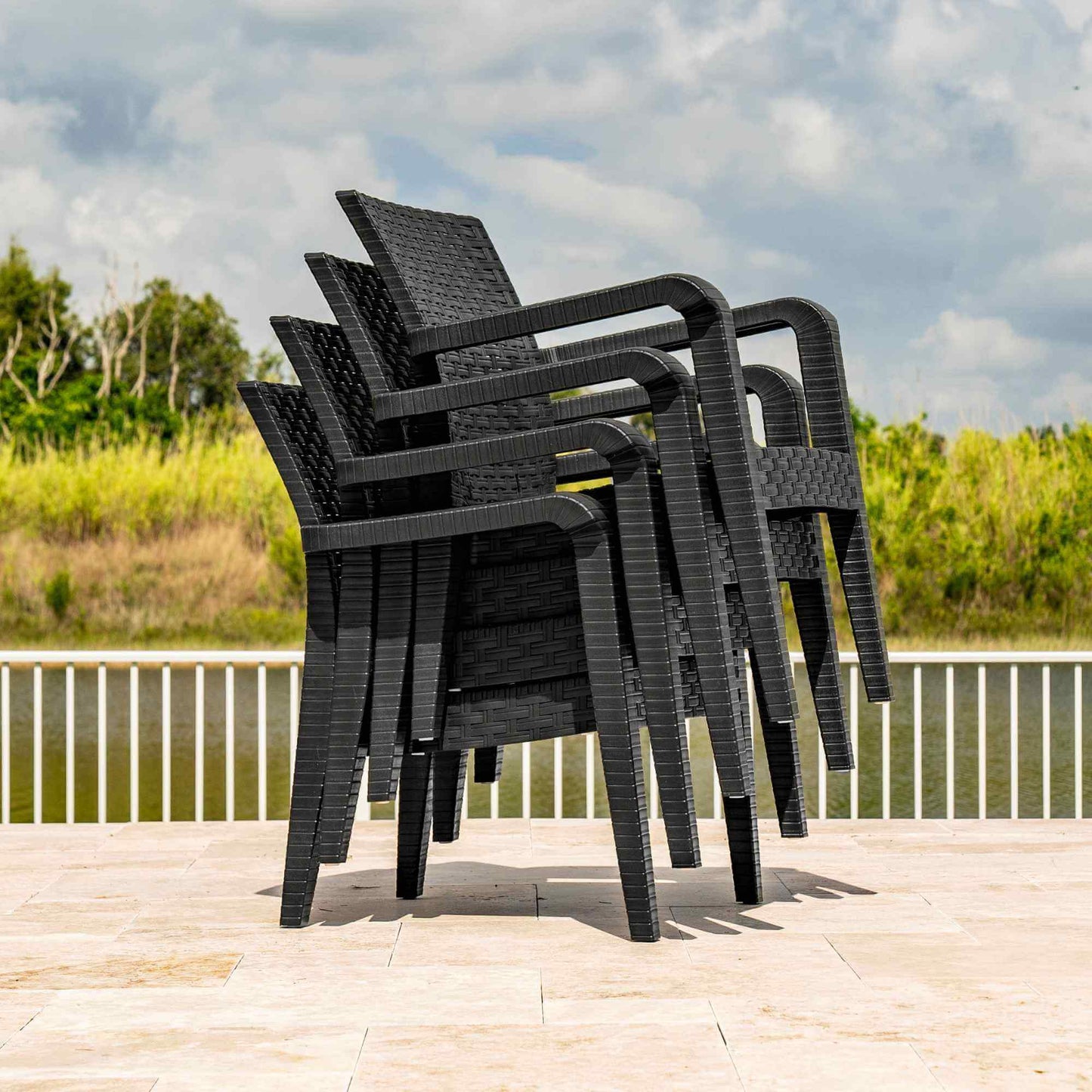 Black outdoor stackable armchairs