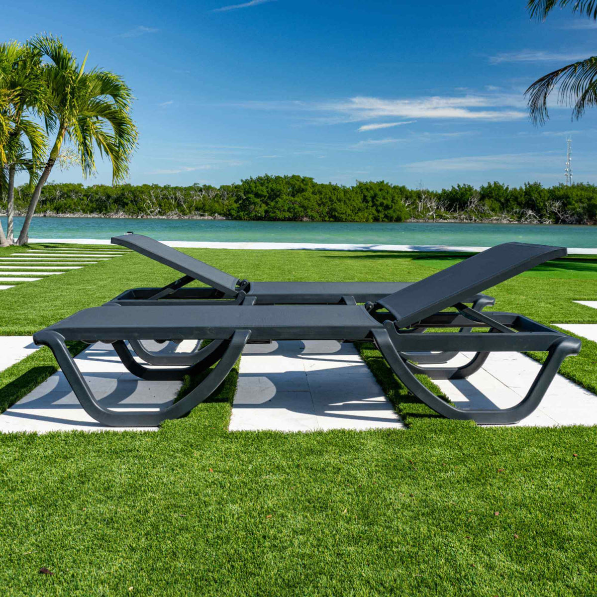 Black set of 2 outdoor sling chaise loungers that are commercial-grade quality for durability and heavy use