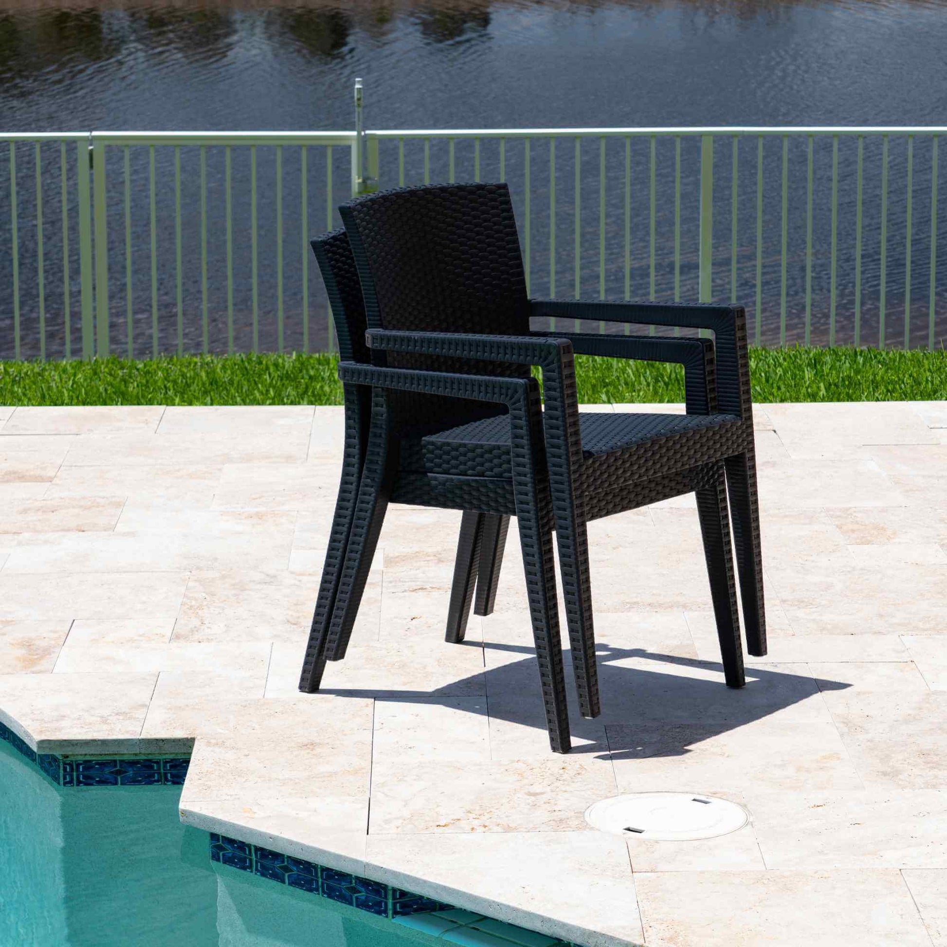 Black 5-piece outdoor dining set includes 1 square table and 4 wicker stackable armchairs