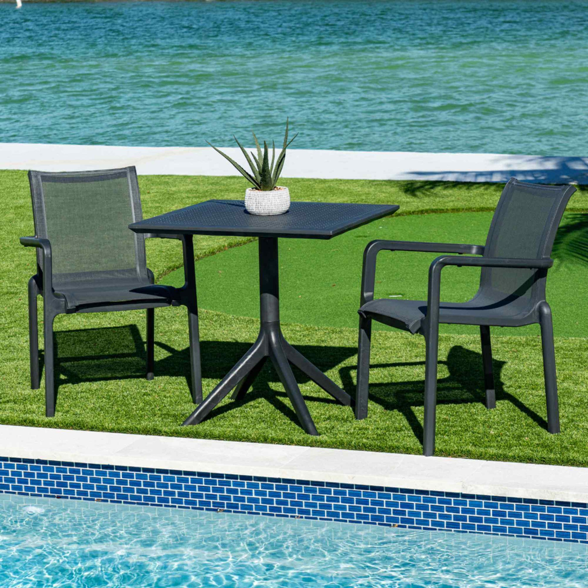 Black sleek set of 2 outdoor sling armchairs with stackable design for easy storage