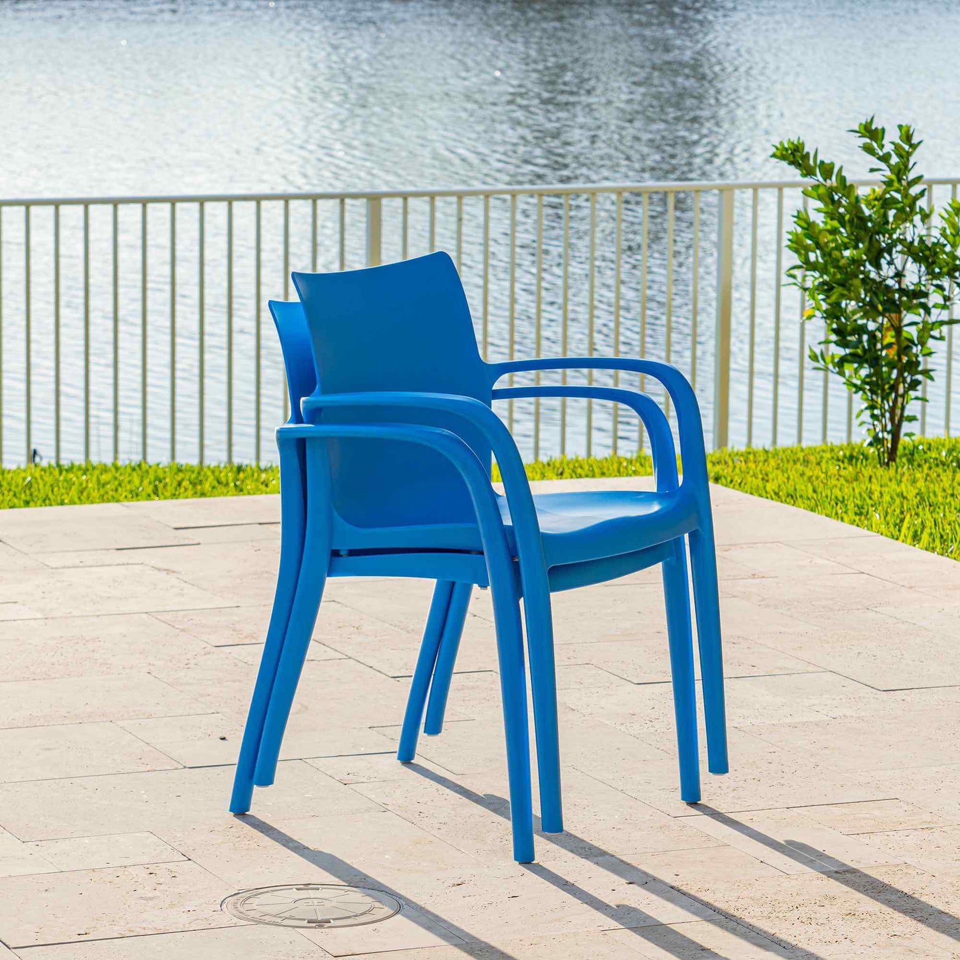 Blue set of 2 outdoor stackable armchairs made of UV resistant resin reinforced with glass fiber