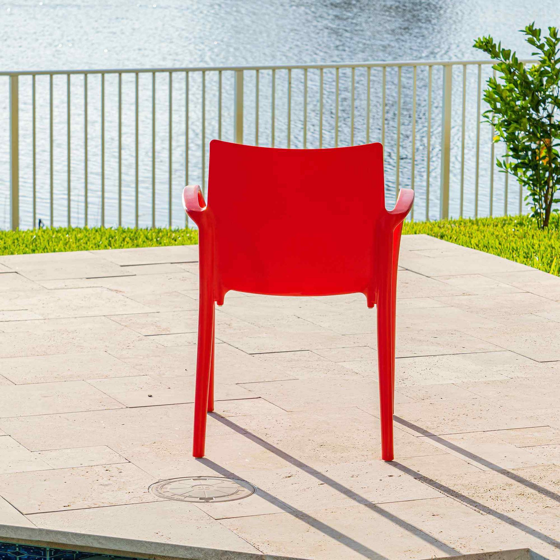 Red set of 2 outdoor stackable armchairs made of UV resistant resin reinforced with glass fiber