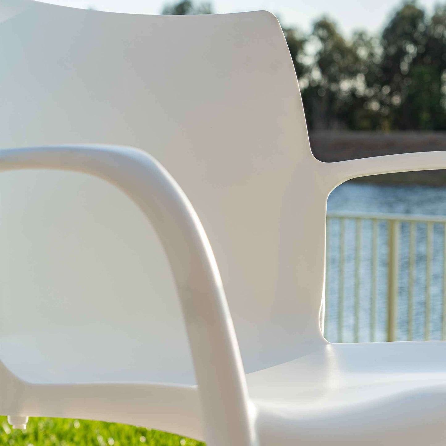 White set of 2 outdoor stackable armchairs made of UV resistant resin reinforced with glass fiber