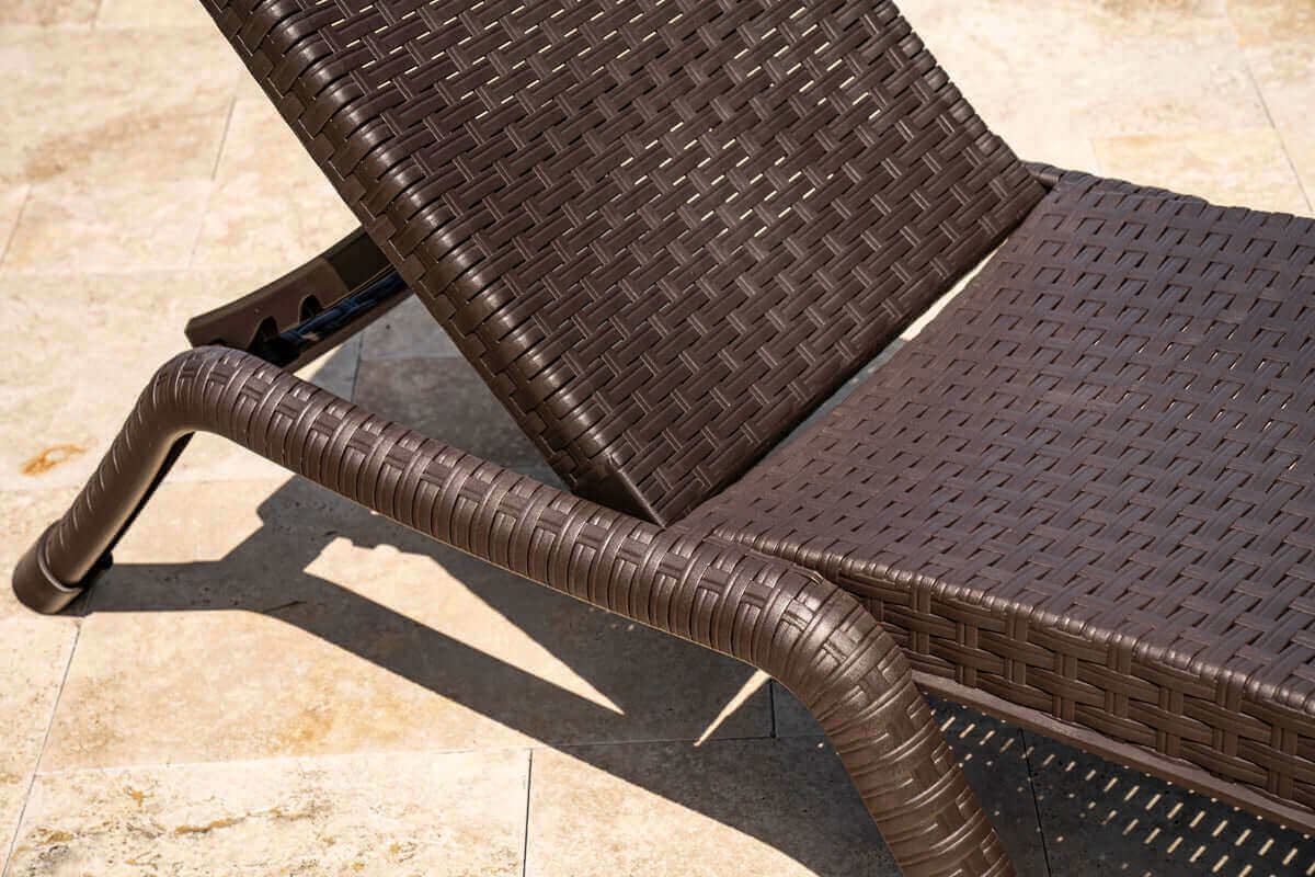 Brown set of 2 outdoor stackable chaise loungers features four-position backrest and hidden back wheels