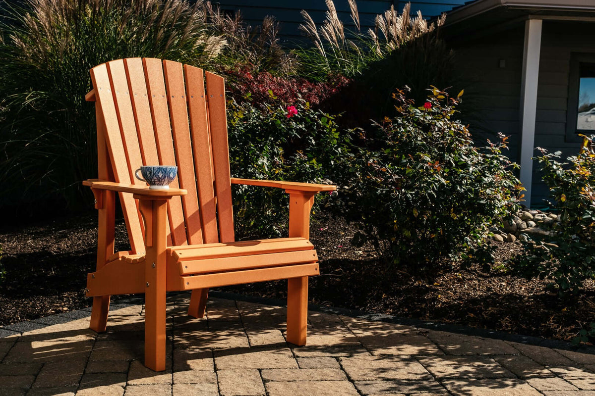 LuxCraft Royal Adirondack Chair in Tangerine paired for patio lounging — weather-resistant design