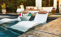 Ledge Lounger Signature Tall Ice Bin Side Table is designed for in-pool use on baja shelves or sun ledges with water depths up to 15 inches, or as a chic addition to your deck, this versatile table keeps your favorite beverages chilled and close at hand.