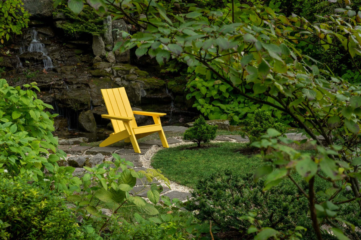 LuxCraft Urban Adirondack Chair in Yellow styled for patio lounging — 20-year poly durability