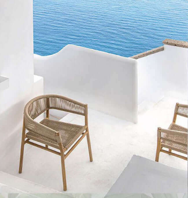 Panama Jack outdoor dining armchairs made with solid Acacia wood construction and fast drying tan rope